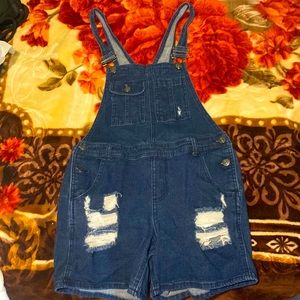 Medium 7-9 denim overalls. Length fits to upper thigh lightly worn